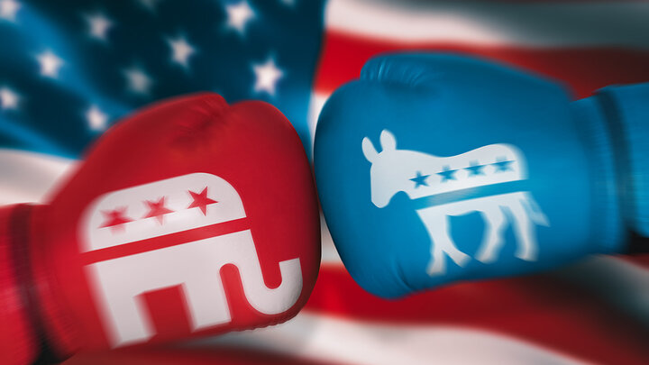 Two boxing gloves inscribed with political symbols is a metaphor for political battles.