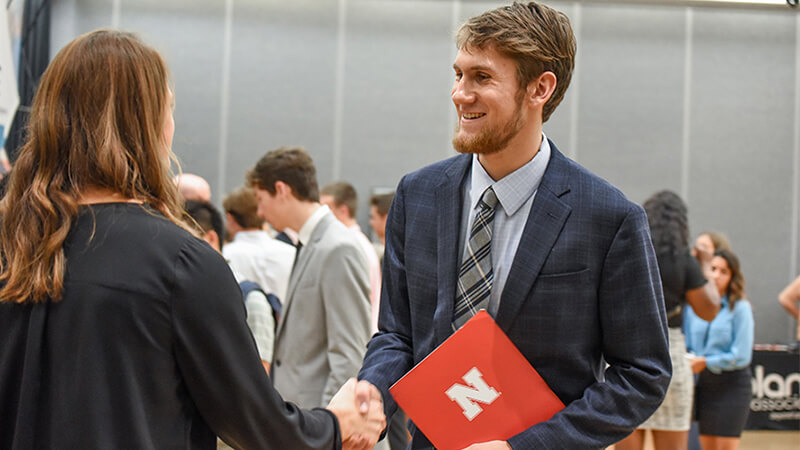 Student talking with employer