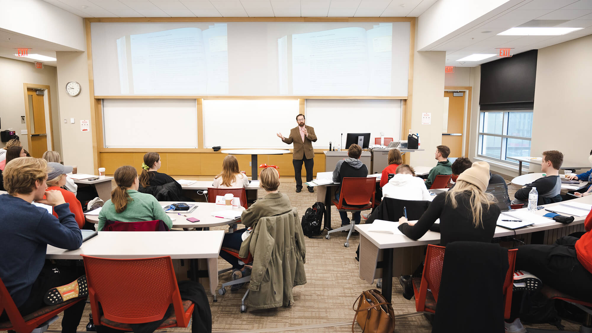 Students in classroom listening to faculty member