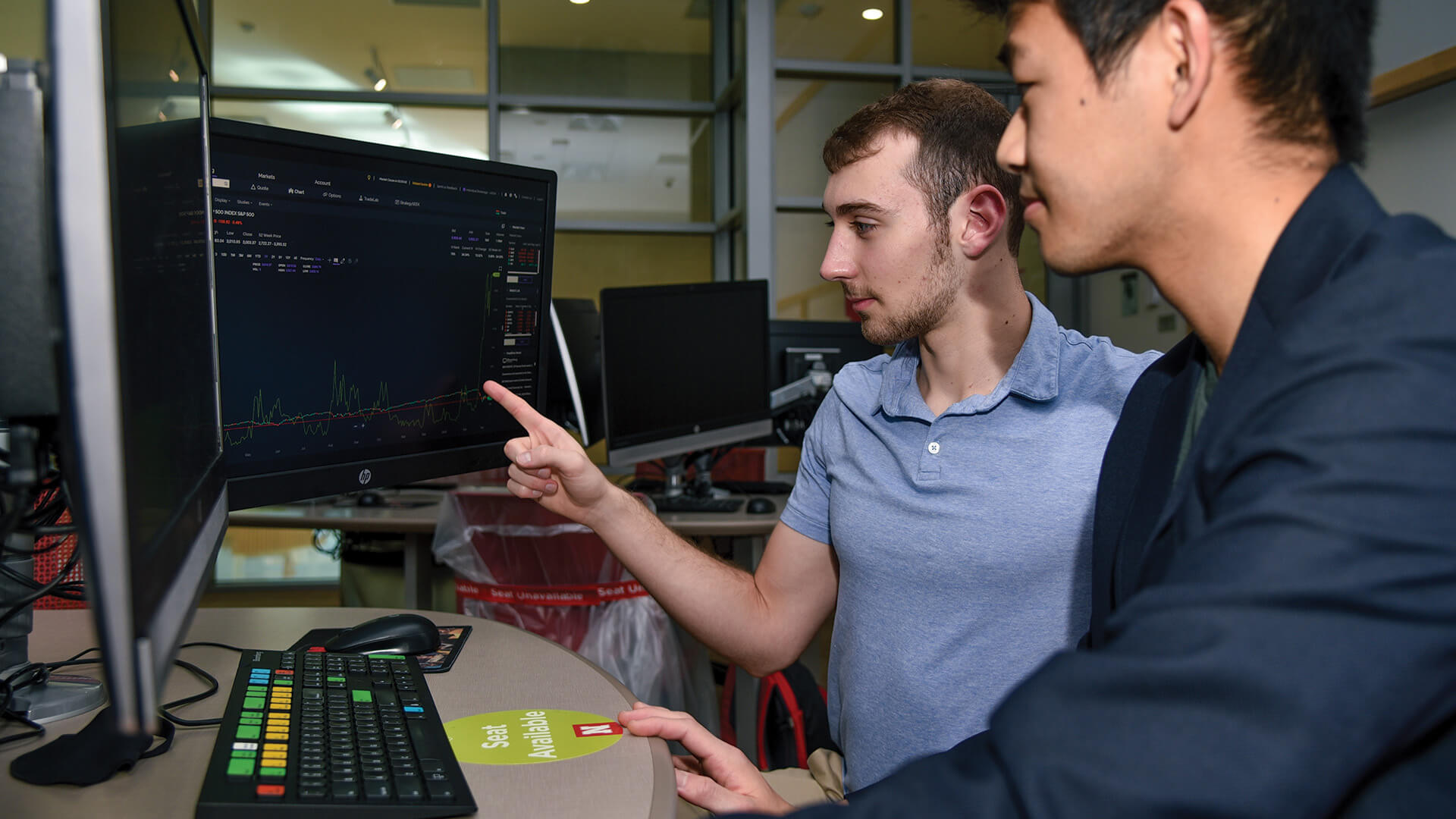 Finance students work at a Bloomberg terminal