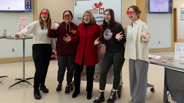Dean Kathy Farrell celebrates a successful Glow Big Red - 24 Hours of Giving with business students.