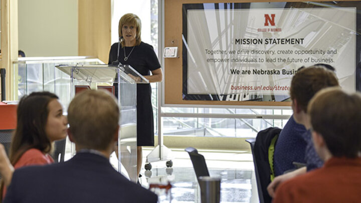 Dean Kathy Farrell addresses the audience at the honors festivities.