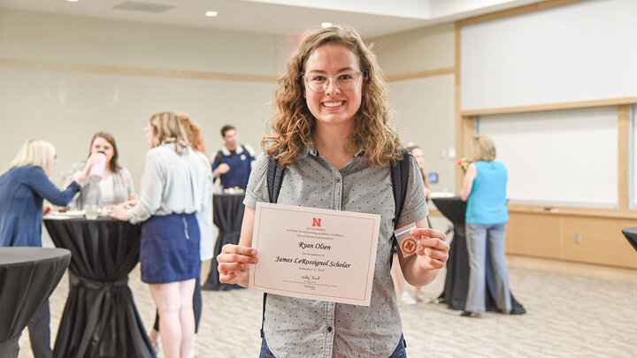 Ryan Olsen, a junior actuarial science major, receives the James LeRossignol Scholar at the presentation ceremony.