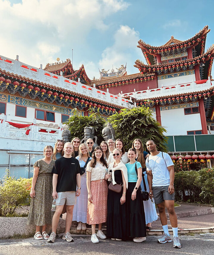 Carolina Barraza (center) coaches a group of students at Methodist College Kuala Lumpur.