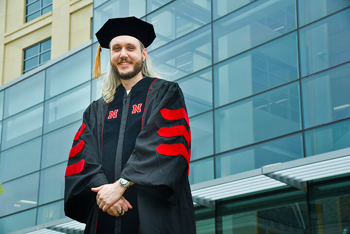 Hanna joins other graduate students for commencement at Pinnacle Bank Arena on May 7.