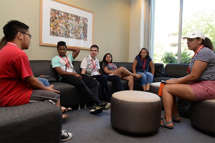 Capell (far right) talks over college life to students at the DREAMBIG Academy, a summer program that provides diverse, upcoming high school seniors the opportunity to learn about the dynamic world of business and potential career opportunities at the College of Business.