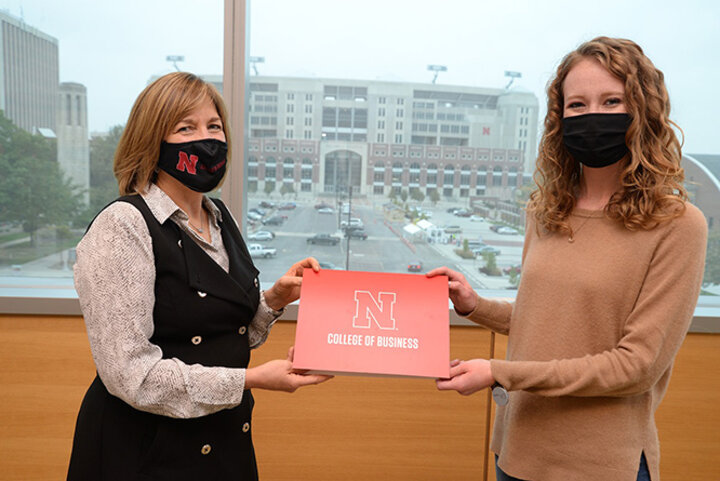 Dean Kathy Farrell recognizes Chloe Higgins, junior economics major, as the student of the month.