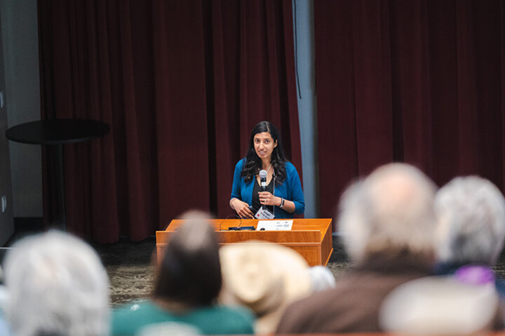Goda, ’00, presenting her economic policy research at the university's Innovation Campus