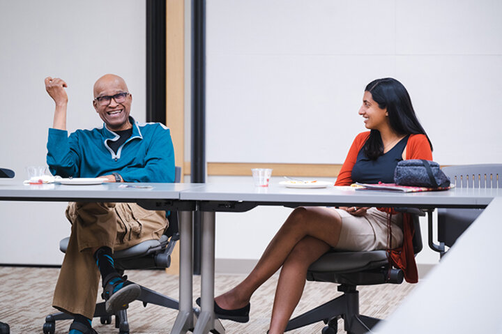 Goda speaking with business students and her academic mentor Colin Ramsay, Edwin J. Faulkner College Professor of actuarial science
