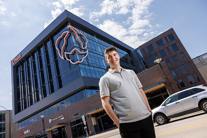 Kinney in front of HUDL Building