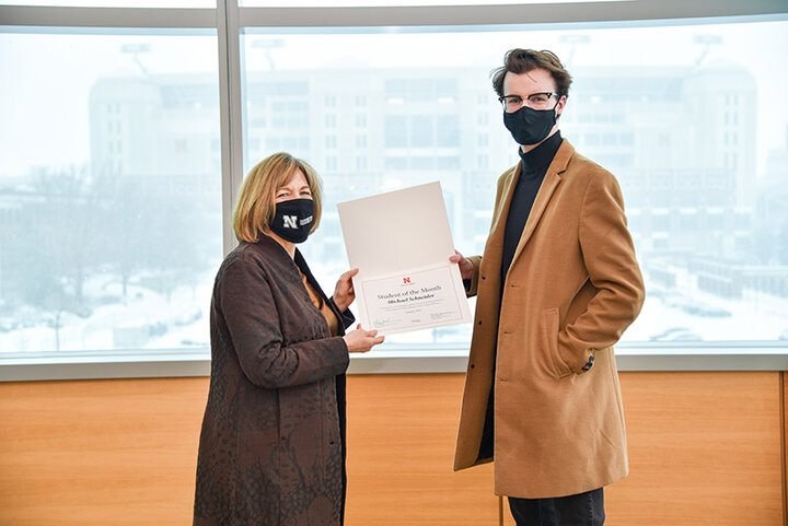 Dean Kathy Farrell recently presented the honor of Nebraska Business Student of the Month honor to Michael Schneider, a senior economics and mathematics major. He was nominated in part for his work and success as a BBR Scholar.