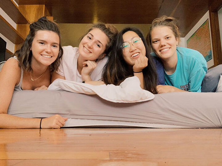 Emme, Ariel, Jessica and Emily rest between packing up to leave Barcelona.
