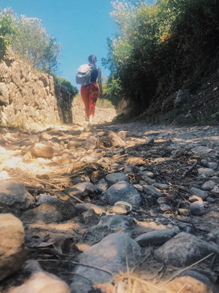 Ariel starts the 3.5-mile trek up to Montserrat, a prominent mountain range that is said to resemble the fingers of God.