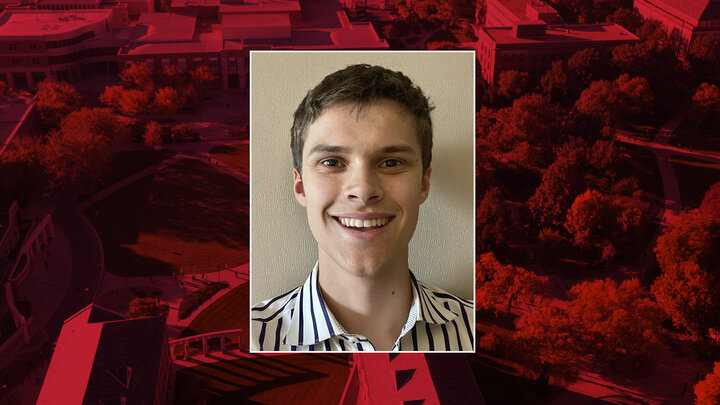 Color portrait of Samuel Ahlquist on a red campus background