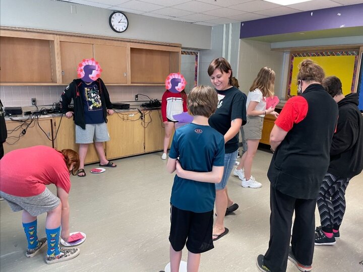 Middle-school youth and facilitators at an after-school club