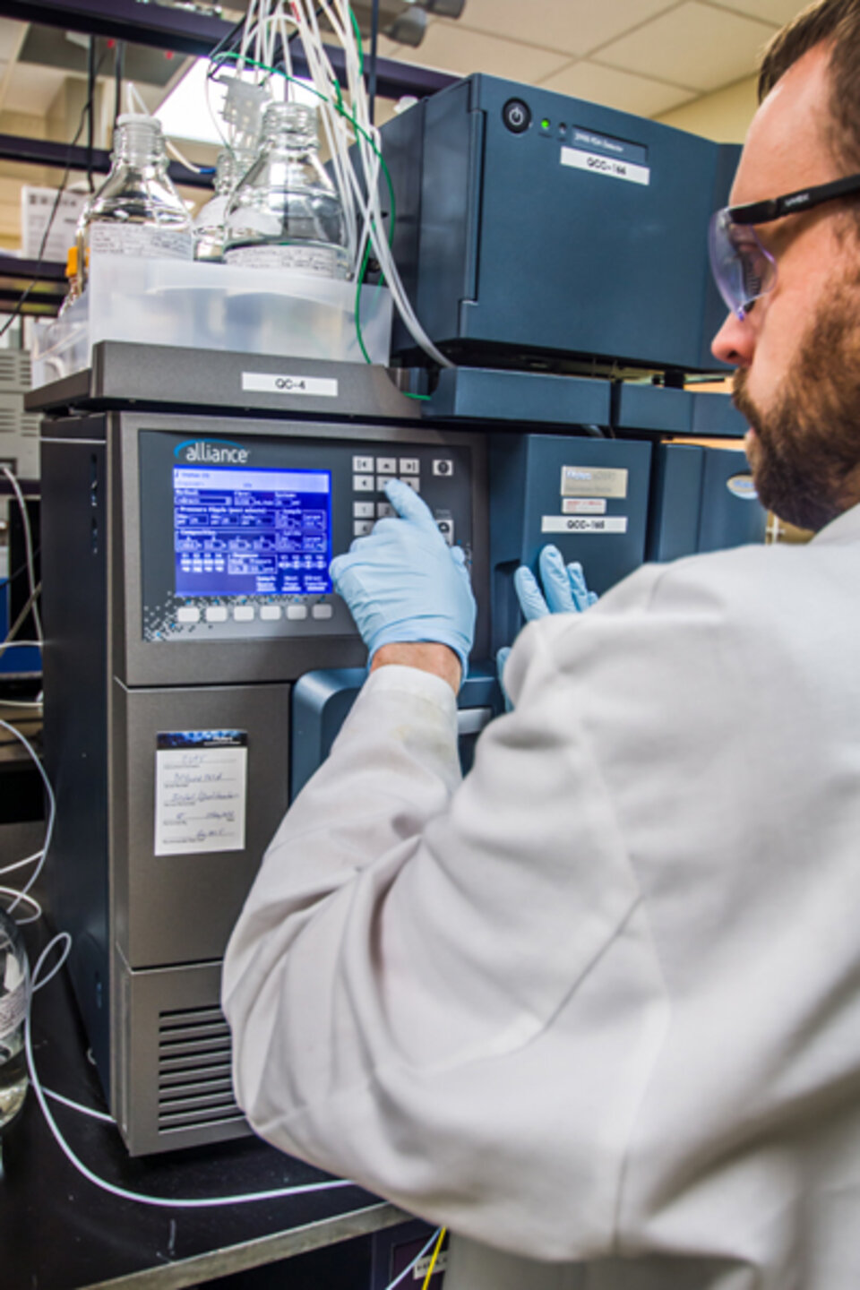 Scientist at instrument panel