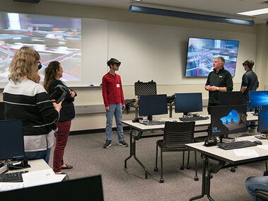 A class of students experimentig with Augmented Reality (AR) for Construction