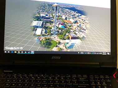 A computer displaying the VR veiw of Google Earth with the HTC-Vive