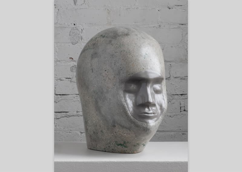 A concrete and acrylic head by Dawson Adams.