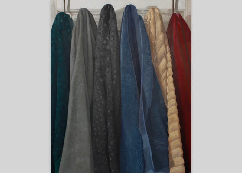 a painting of towels hung on a wall.