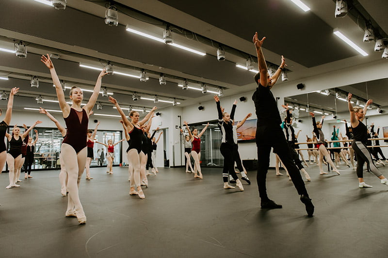 Dancers practice their moves.