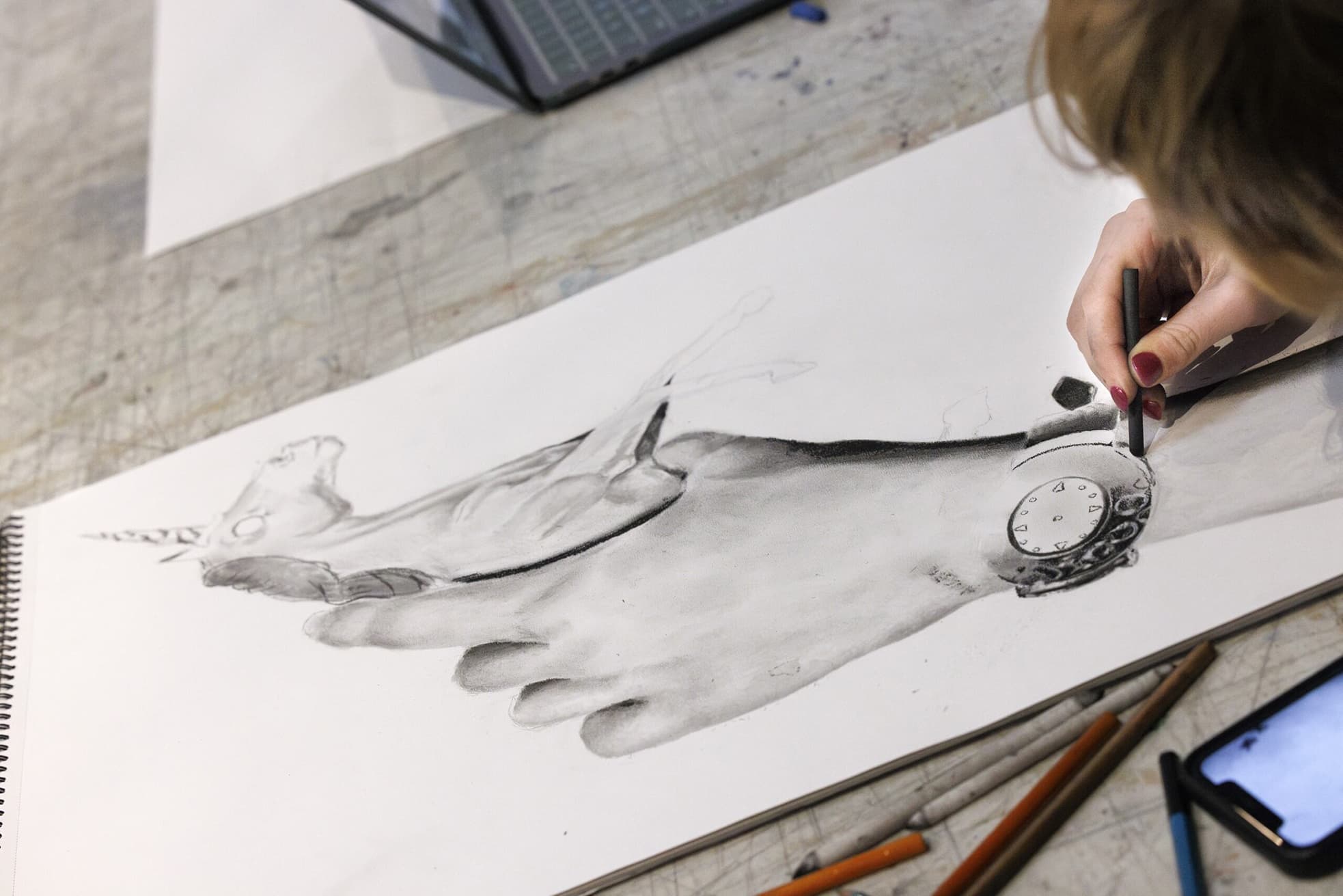 Close up of a student working on a drawing.