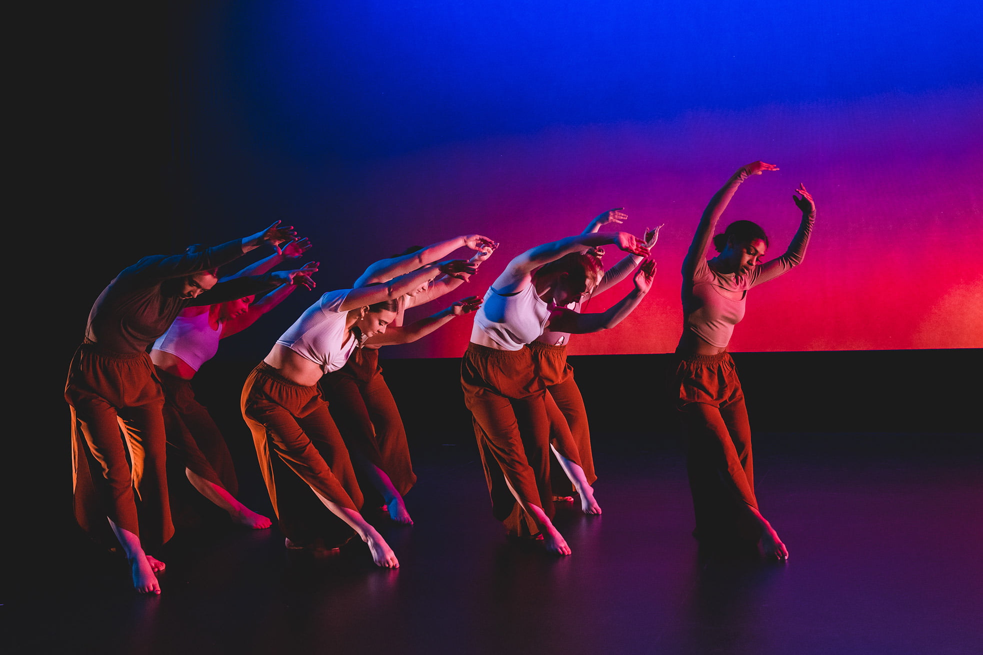 Dancers performing on stage.