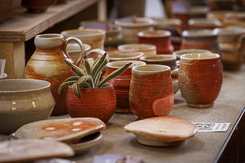 A collection of ceramics sit on a table.