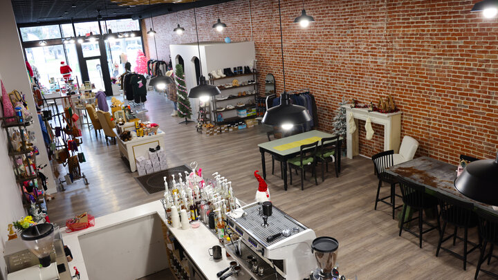 The newly remodeled Hey Honey Boutique boasts original brickwork and tin ceiling tiles. 