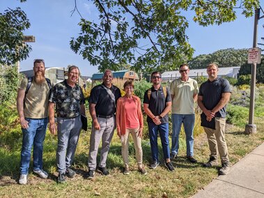 Members of the Nebraska Invasive Species Council standing in front of the Backyard Farmer Garden on the University of Nebraska-Lincoln's East Campus.