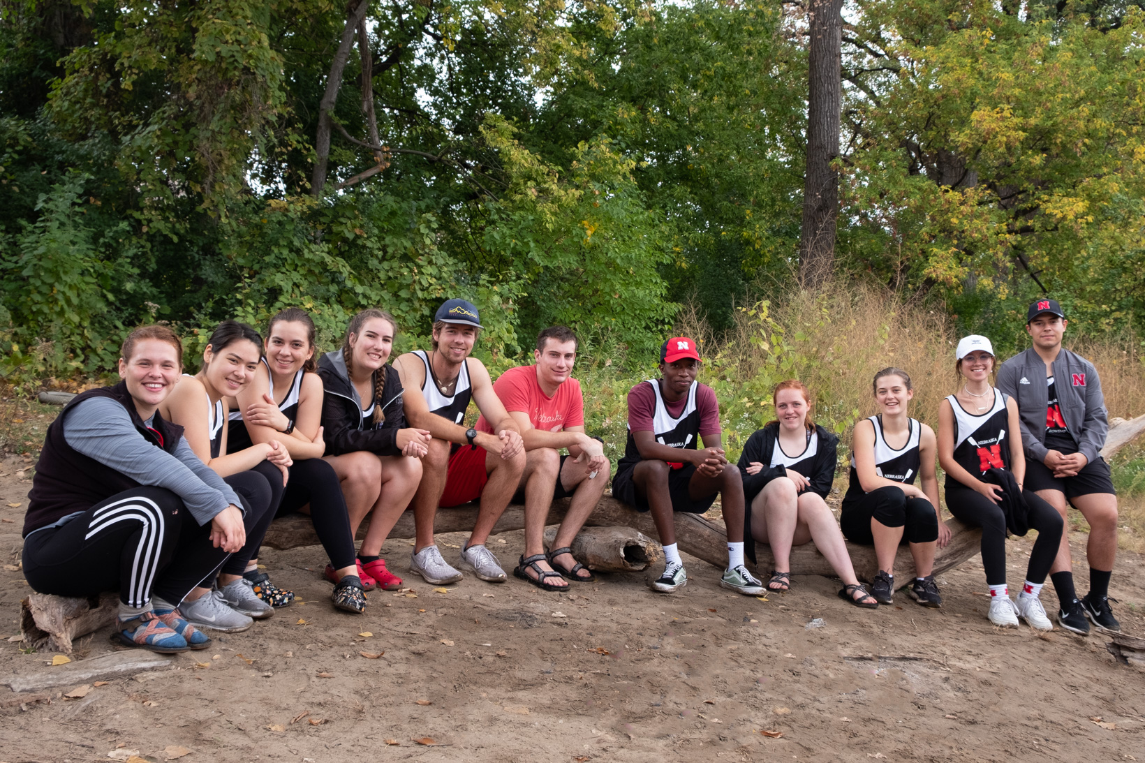 Group of student rowers sitting in a line.