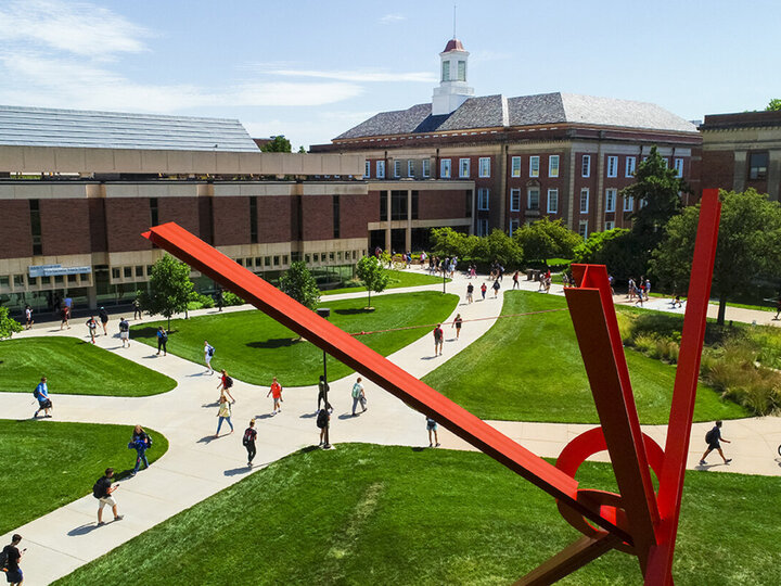 Northwest view of exterior of Love north and south with students walking on the paths