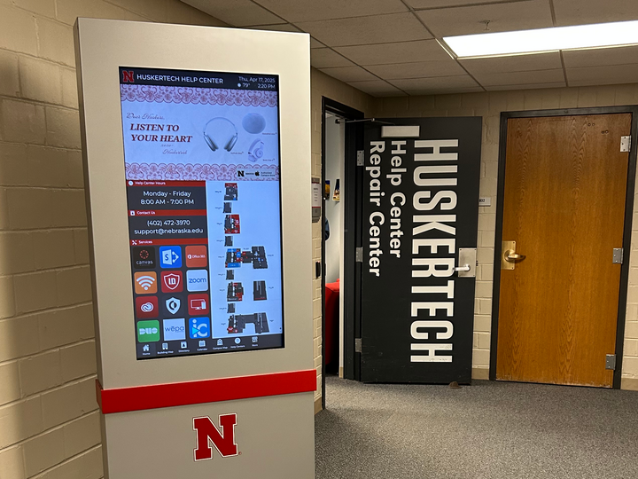 Photo of the Huskertech Help Center door and kiosk
