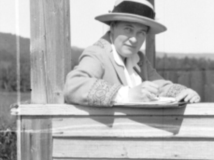 Photo of Willa Cather writing